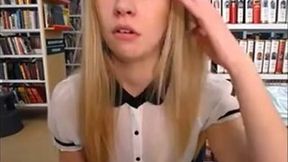 Slim and sexy blonde stripping in public library