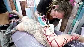 Stunning Tattoo Babe with Big Tits enjoys ANAL fuck while getting a Tattoo - ATM&Gaping