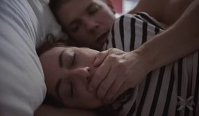 brunette couple on bed